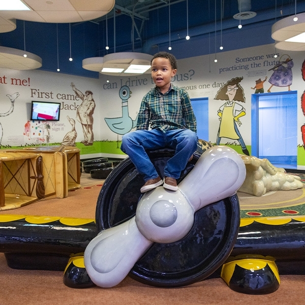 Kid playing on Kidport at Boston Logan