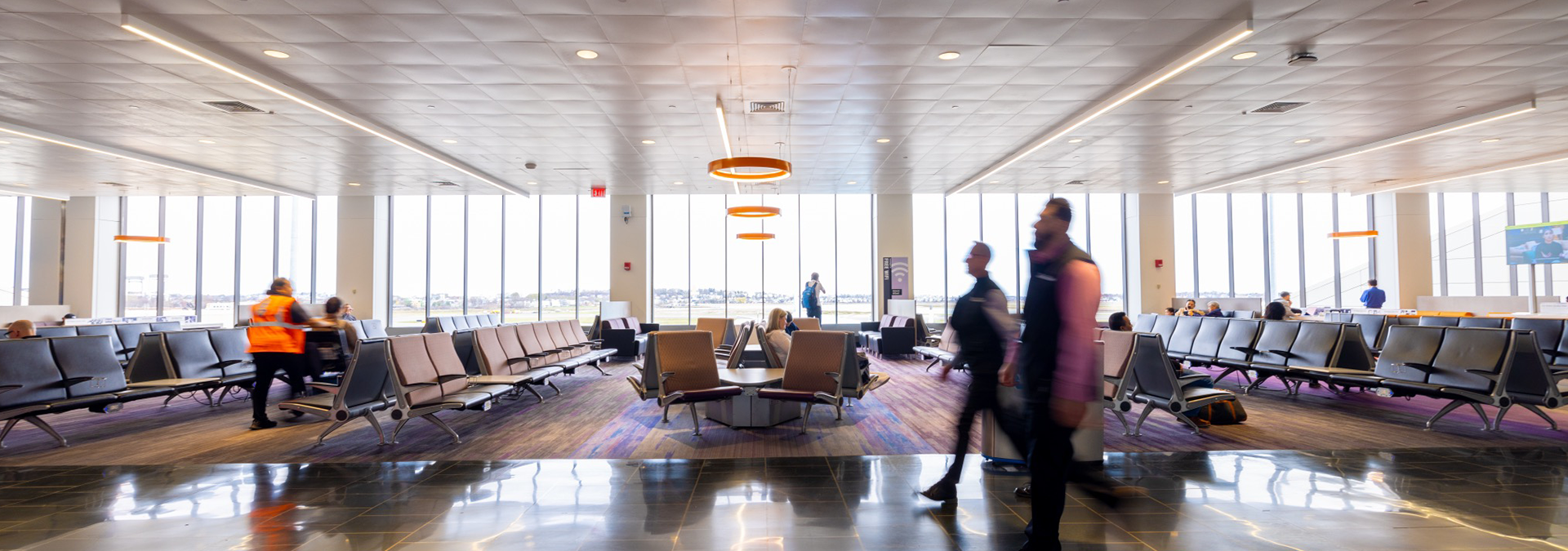 Passengers walk in Boston Logan airport