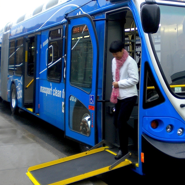 Women getting of bus ramp