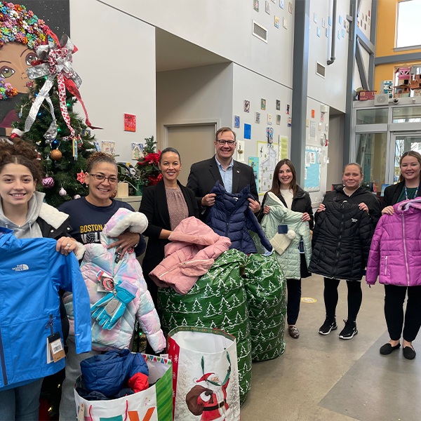 Massport employees at school for student coat drive