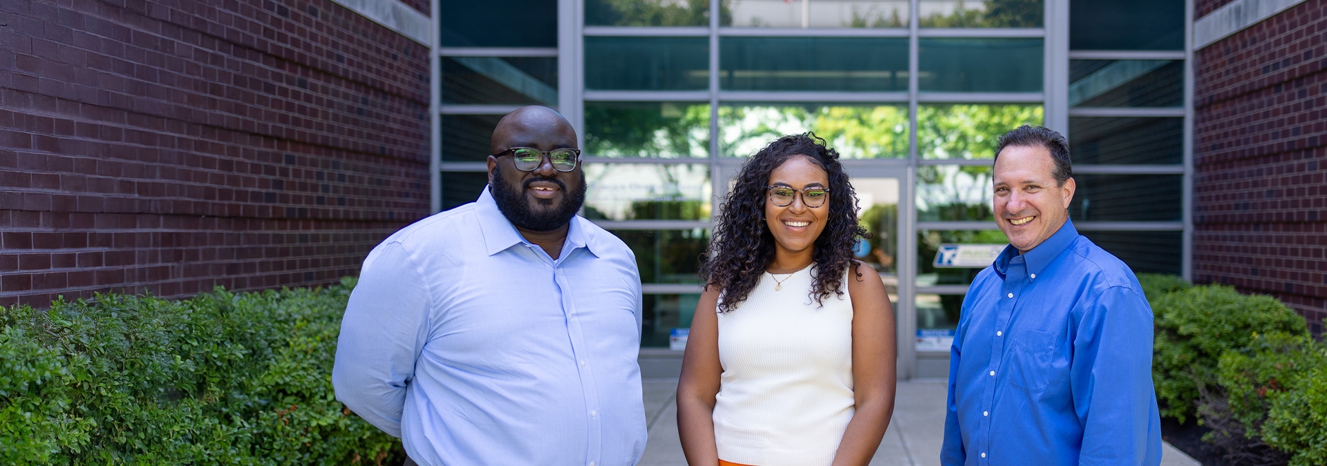 HR Team in front of the Logan Office Center