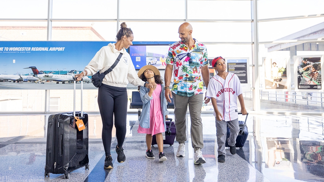 Family walking through Worcester airport