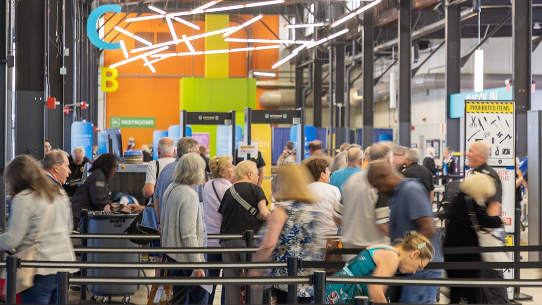 Passengers walking through cruise terminal