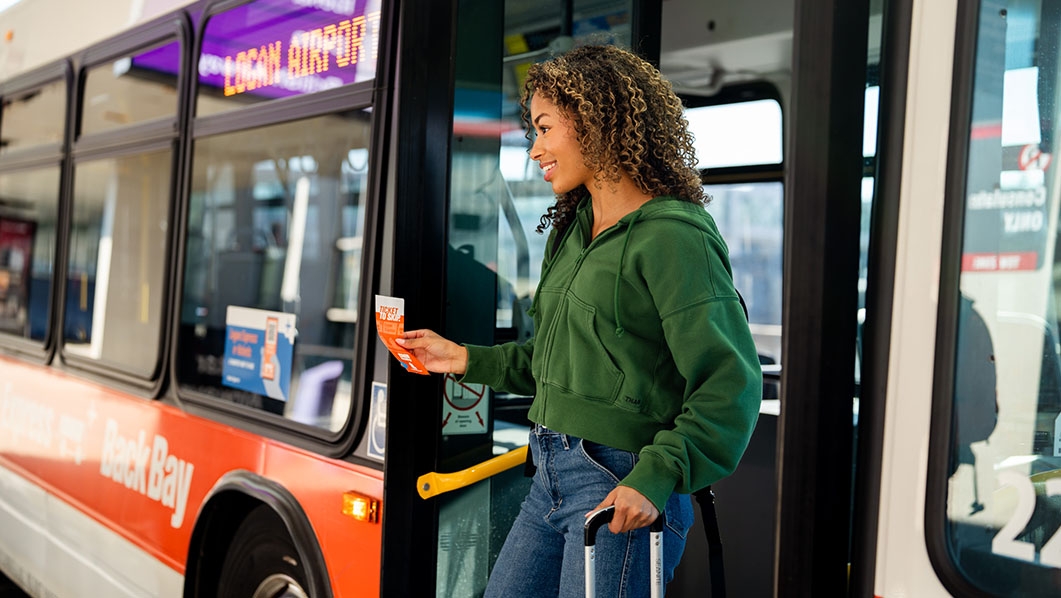 Lady getting off Logan Express bus