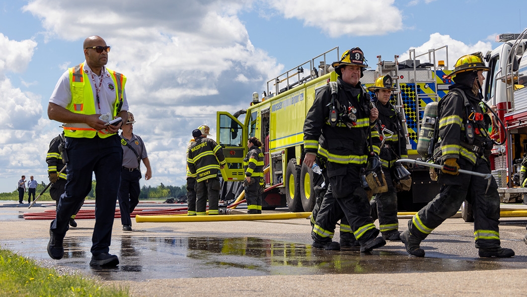 Fire trucks and firemen on Worcester runway