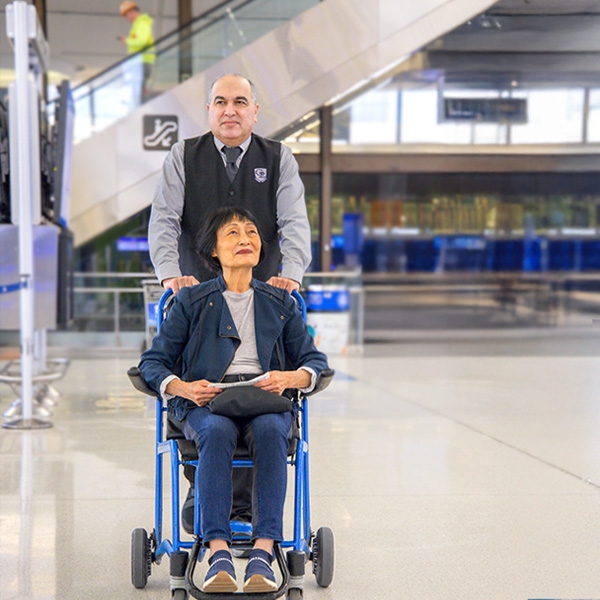 Women in wheelchair in terminal